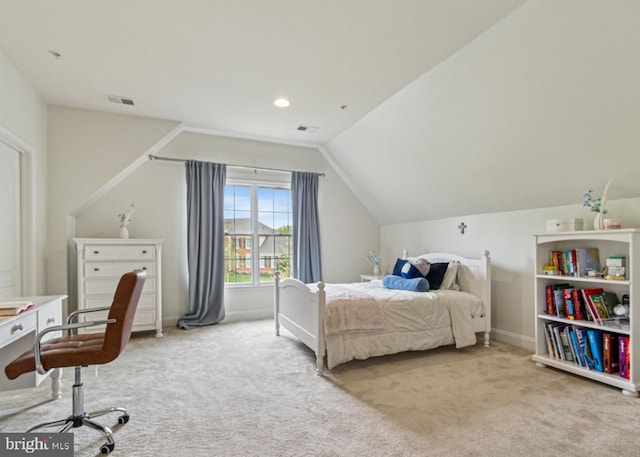 carpeted bedroom with lofted ceiling, baseboards, and visible vents