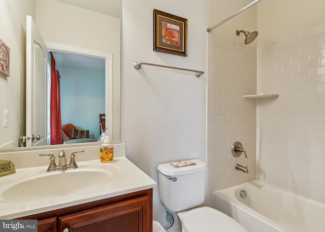 full bath featuring vanity, washtub / shower combination, and toilet
