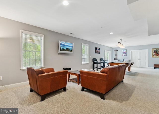 living area featuring recessed lighting, carpet, and baseboards