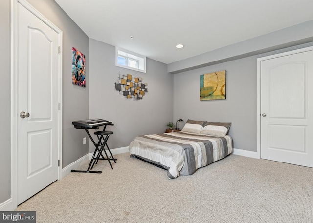 carpeted bedroom featuring baseboards and recessed lighting