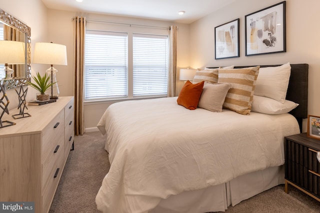 bedroom with carpet floors and baseboards