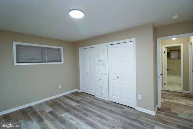 2214 Wintergreen Ave, District Heights, MD 20747 - unfurnished bedroom with baseboards and wood finished floors