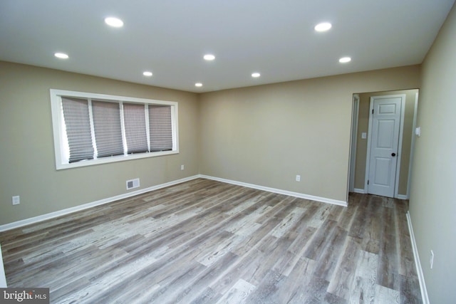 2214 Wintergreen Ave, District Heights, MD 20747 - spare room featuring wood finished floors, baseboards, visible vents, and recessed lighting