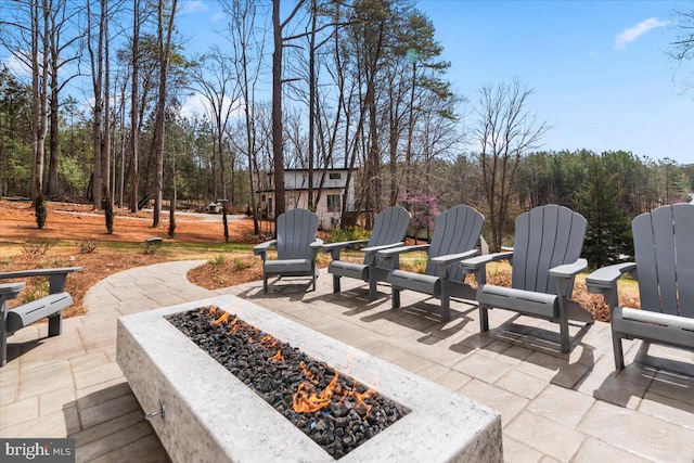view of patio with an outdoor fire pit
