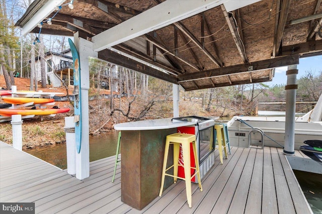 wooden deck with a water view