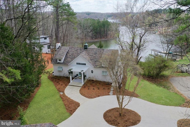 aerial view with a view of trees and a water view