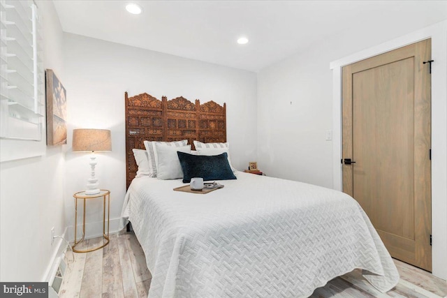 bedroom featuring recessed lighting, baseboards, and wood finished floors