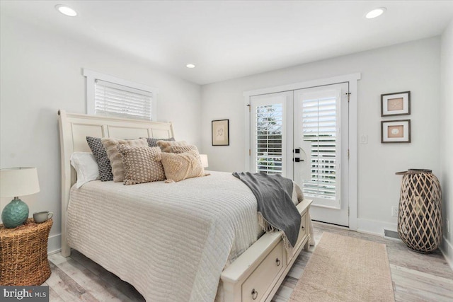 bedroom featuring french doors, light wood-style floors, access to exterior, and recessed lighting