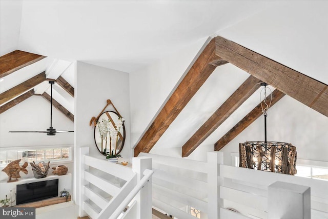 staircase with vaulted ceiling with beams