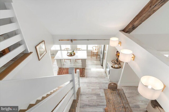 stairway featuring wood finished floors