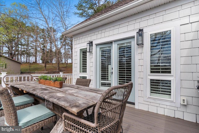 wooden deck featuring outdoor dining space