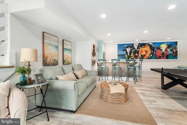 living room featuring wood finished floors and recessed lighting