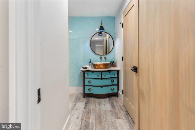 bathroom with vanity and wood finished floors