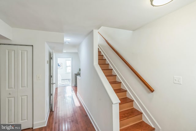 interior space with baseboards, recessed lighting, stairway, and dark wood finished floors