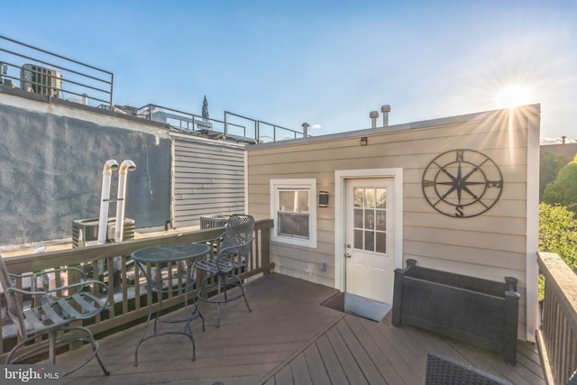 wooden deck featuring outdoor dining area