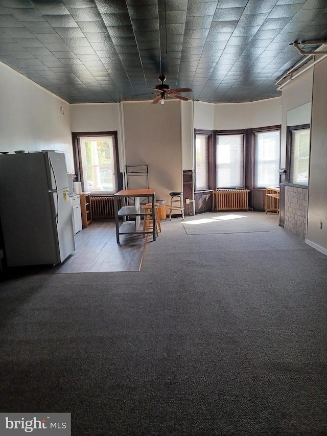 120 Arch St, Catasauqua, PA 18032 - interior space with radiator heating unit, ceiling fan, and carpet floors