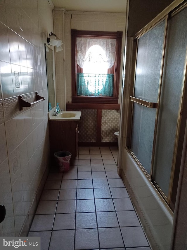 120 Arch St, Catasauqua, PA 18032 - bathroom featuring bath / shower combo with glass door, toilet, tile patterned flooring, and vanity
