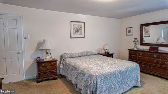 bedroom featuring light carpet