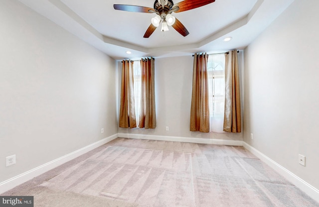 unfurnished room with light carpet, ceiling fan, baseboards, and recessed lighting