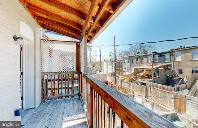 wooden deck with a residential view
