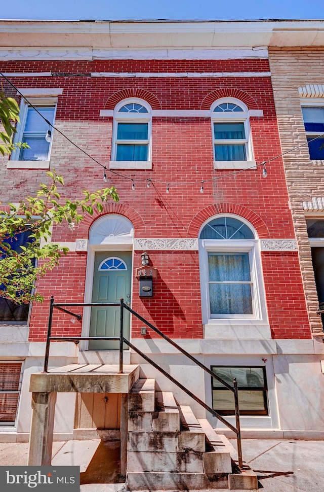 view of front of house with brick siding