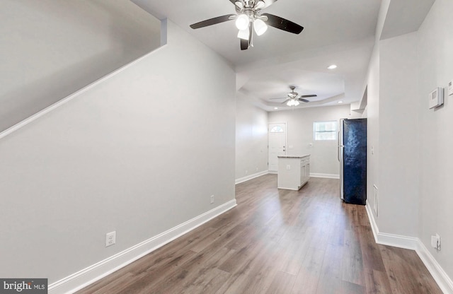 interior space with recessed lighting, dark wood-type flooring, baseboards, and ceiling fan