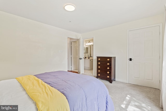 20605 Cornstalk Ter Unit 201, Ashburn, VA 20147 - bedroom with ensuite bath and light carpet