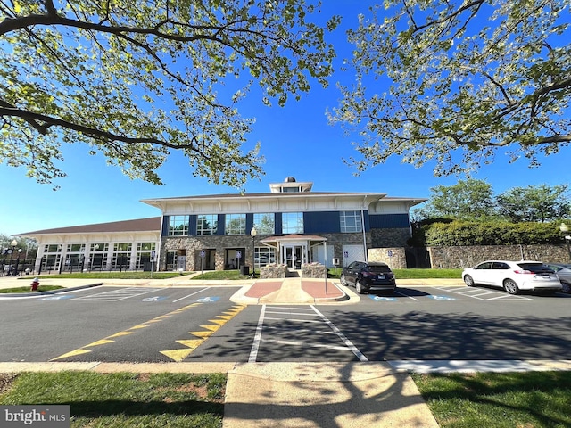 20605 Cornstalk Ter Unit 201, Ashburn, VA 20147 - view of building exterior featuring uncovered parking