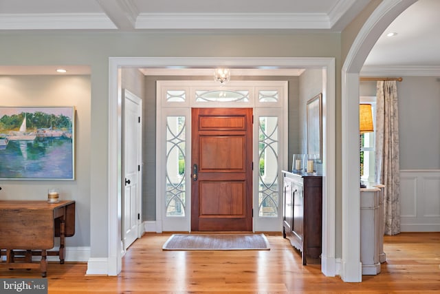 208 Wardour Dr, Annapolis, MD 21401 - foyer with arched walkways, light wood-style floors, and ornamental molding