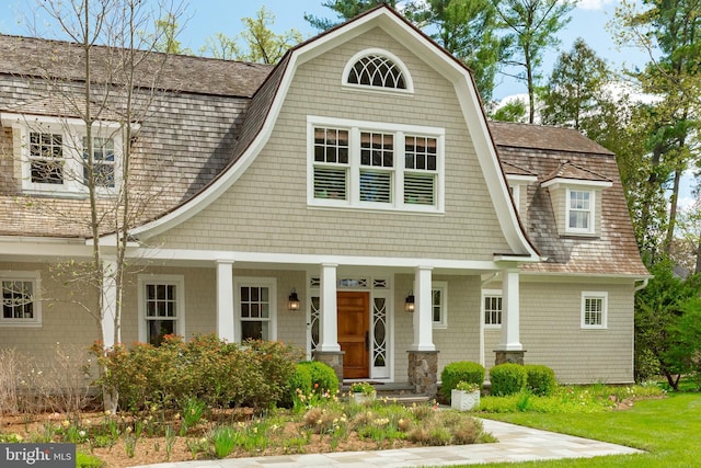 208 Wardour Dr, Annapolis, MD 21401 - view of front of house featuring a gambrel roof, covered porch, and roof with shingles