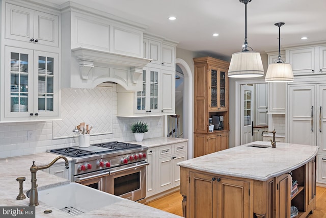 208 Wardour Dr, Annapolis, MD 21401 - kitchen featuring white cabinets, tasteful backsplash, premium appliances, recessed lighting, and light stone countertops