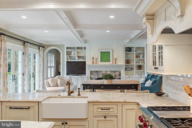 208 Wardour Dr, Annapolis, MD 21401 - kitchen featuring open floor plan, a sink, cream cabinetry, and light stone counters