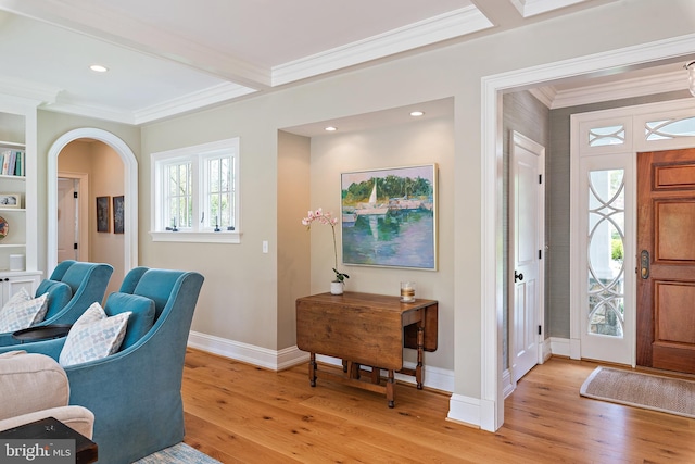 208 Wardour Dr, Annapolis, MD 21401 - foyer entrance with arched walkways, baseboards, crown molding, and light wood-type flooring