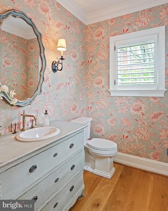 208 Wardour Dr, Annapolis, MD 21401 - half bath featuring wood finished floors, toilet, vanity, ornamental molding, and baseboards