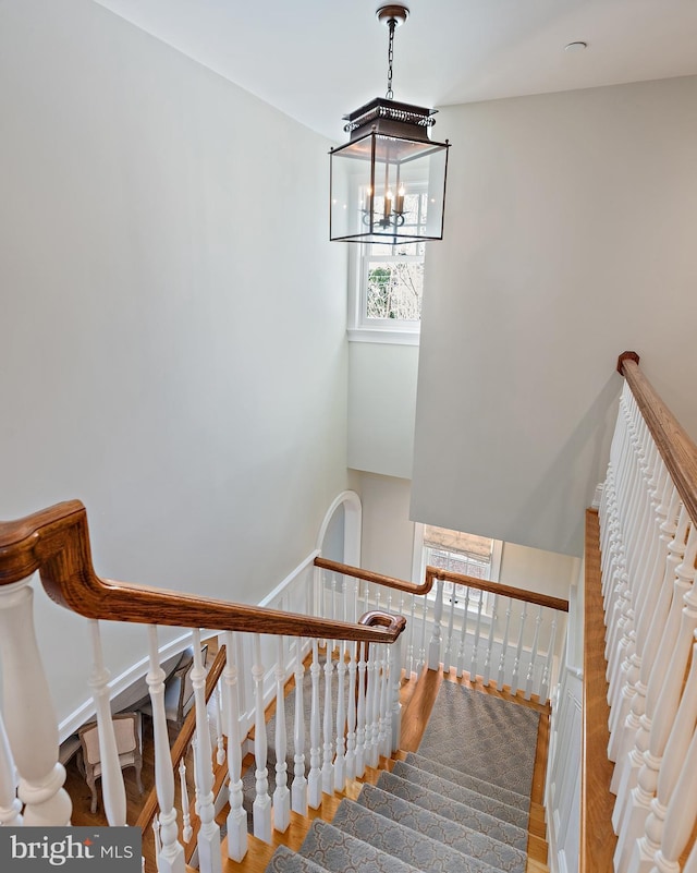 208 Wardour Dr, Annapolis, MD 21401 - stairs featuring an inviting chandelier and wood finished floors