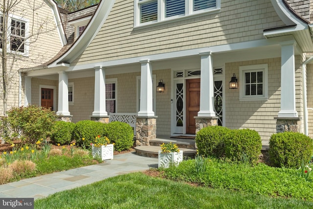 208 Wardour Dr, Annapolis, MD 21401 - property entrance with a gambrel roof, stone siding, and covered porch