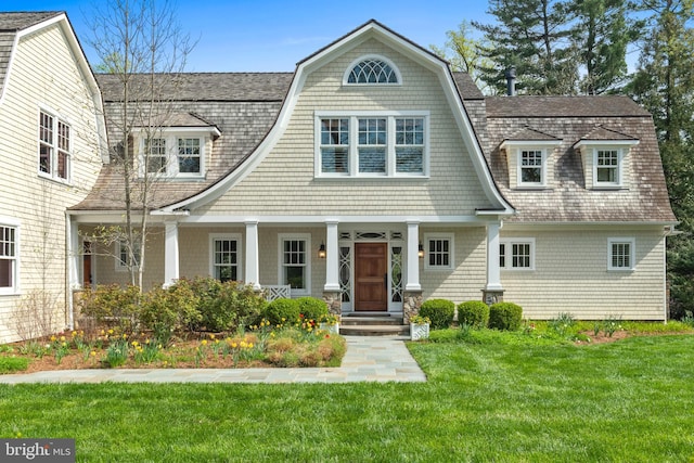 208 Wardour Dr, Annapolis, MD 21401 - view of front of house with a porch, a gambrel roof, roof with shingles, and a front yard