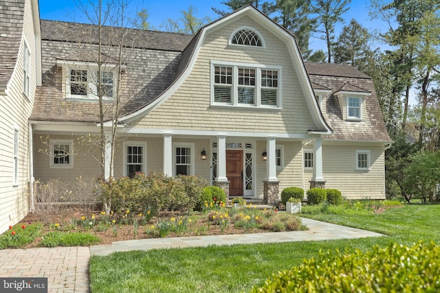208 Wardour Dr, Annapolis, MD 21401 - view of front of home featuring a front lawn, a gambrel roof, a porch, and roof with shingles