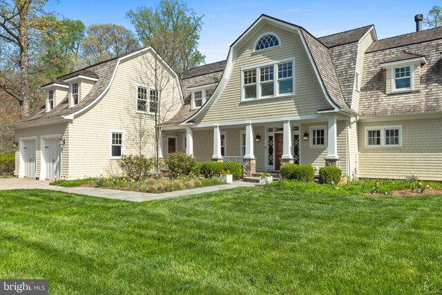 208 Wardour Dr, Annapolis, MD 21401 - view of front facade with a porch, a gambrel roof, driveway, and a front yard