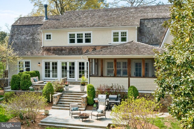 208 Wardour Dr, Annapolis, MD 21401 - back of property with a patio area, stairs, french doors, and an outdoor living space with a fire pit