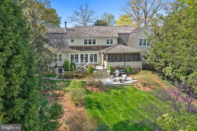 208 Wardour Dr, Annapolis, MD 21401 - back of house with a gambrel roof, a yard, a patio area, french doors, and a sunroom