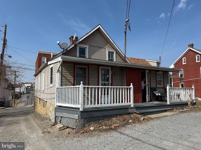 view of front facade with a porch and crawl space