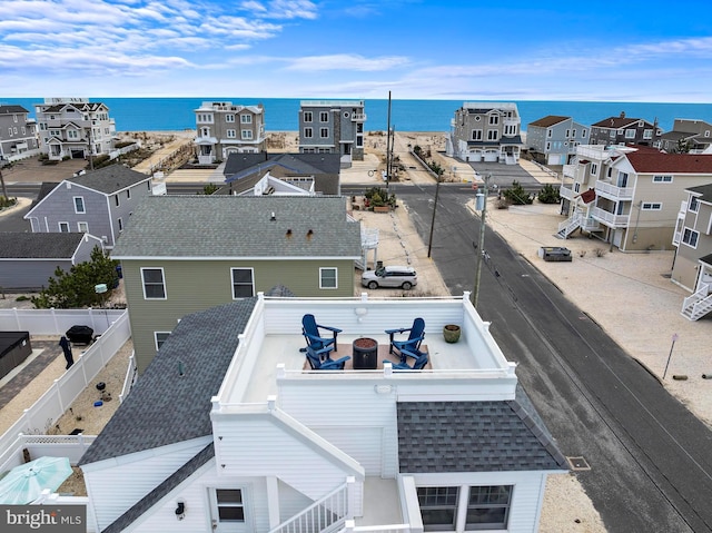 bird's eye view with a residential view and a water view