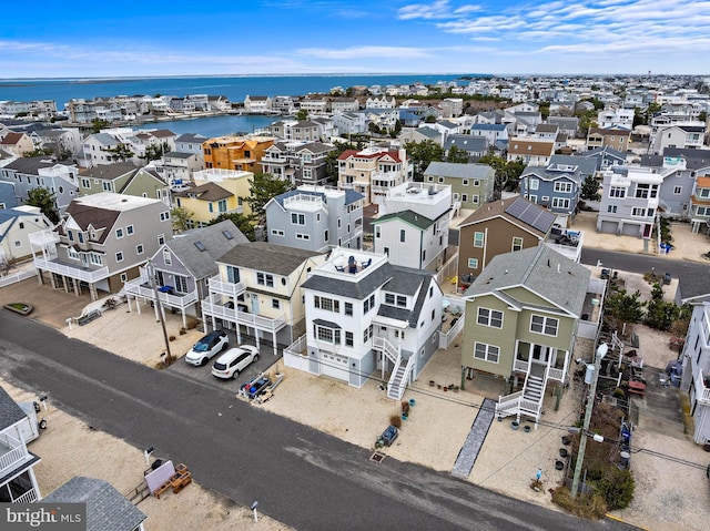 aerial view featuring a water view and a residential view