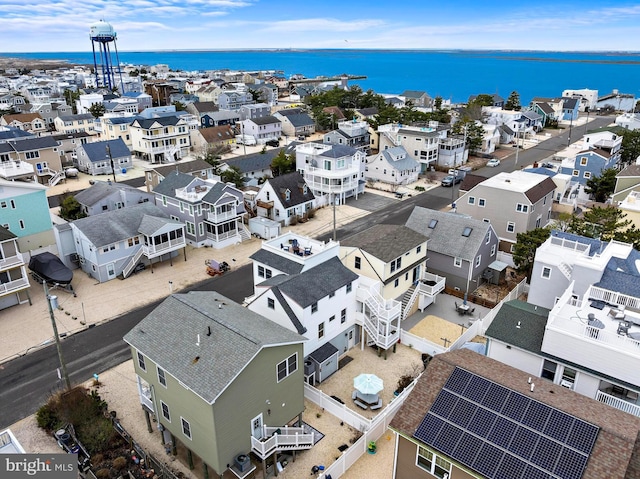 aerial view with a residential view and a water view
