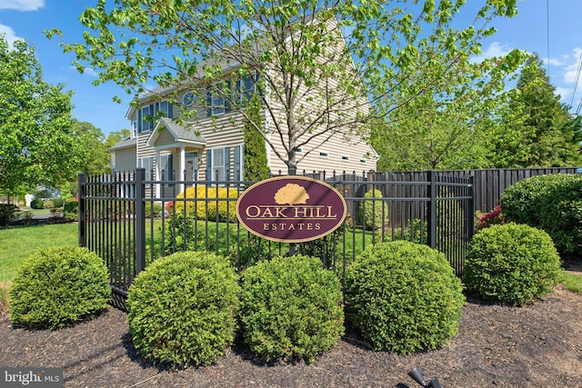 community sign featuring fence