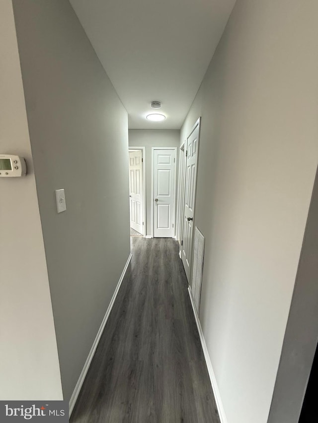 10224 Prince Pl Unit 12-307, Upper Marlboro, MD 20774 - corridor featuring baseboards and dark wood-type flooring