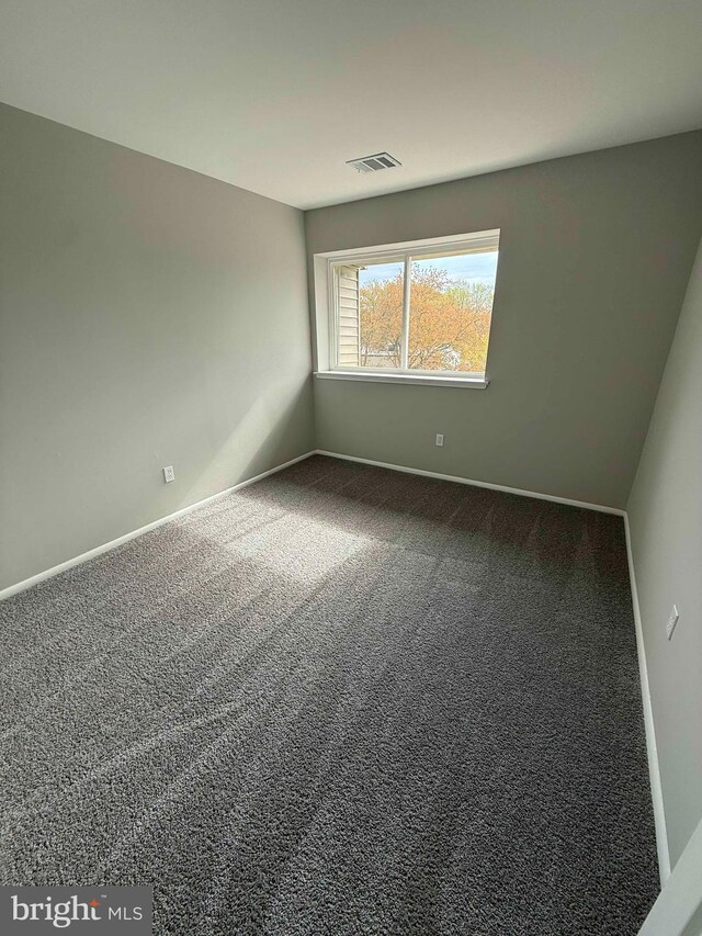 10224 Prince Pl Unit 12-307, Upper Marlboro, MD 20774 - empty room featuring baseboards, visible vents, and carpet flooring