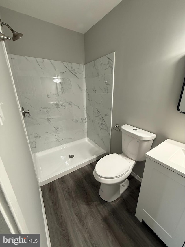 10224 Prince Pl Unit 12-307, Upper Marlboro, MD 20774 - bathroom with a stall shower, wood finished floors, vanity, and toilet