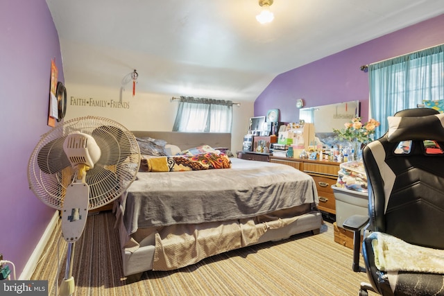 bedroom featuring lofted ceiling